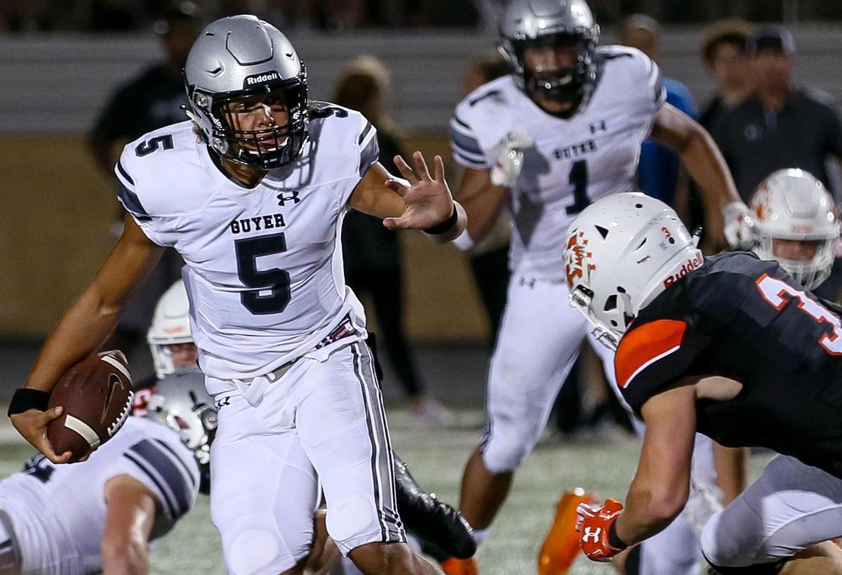 Denton Guyer quarterback Eli Stowers (5) tries to get past defensive back Nathan Fingar (3) during the second half, Friday night, August 30, 2019 played at Bearcat Stadium in Aledo, TX.