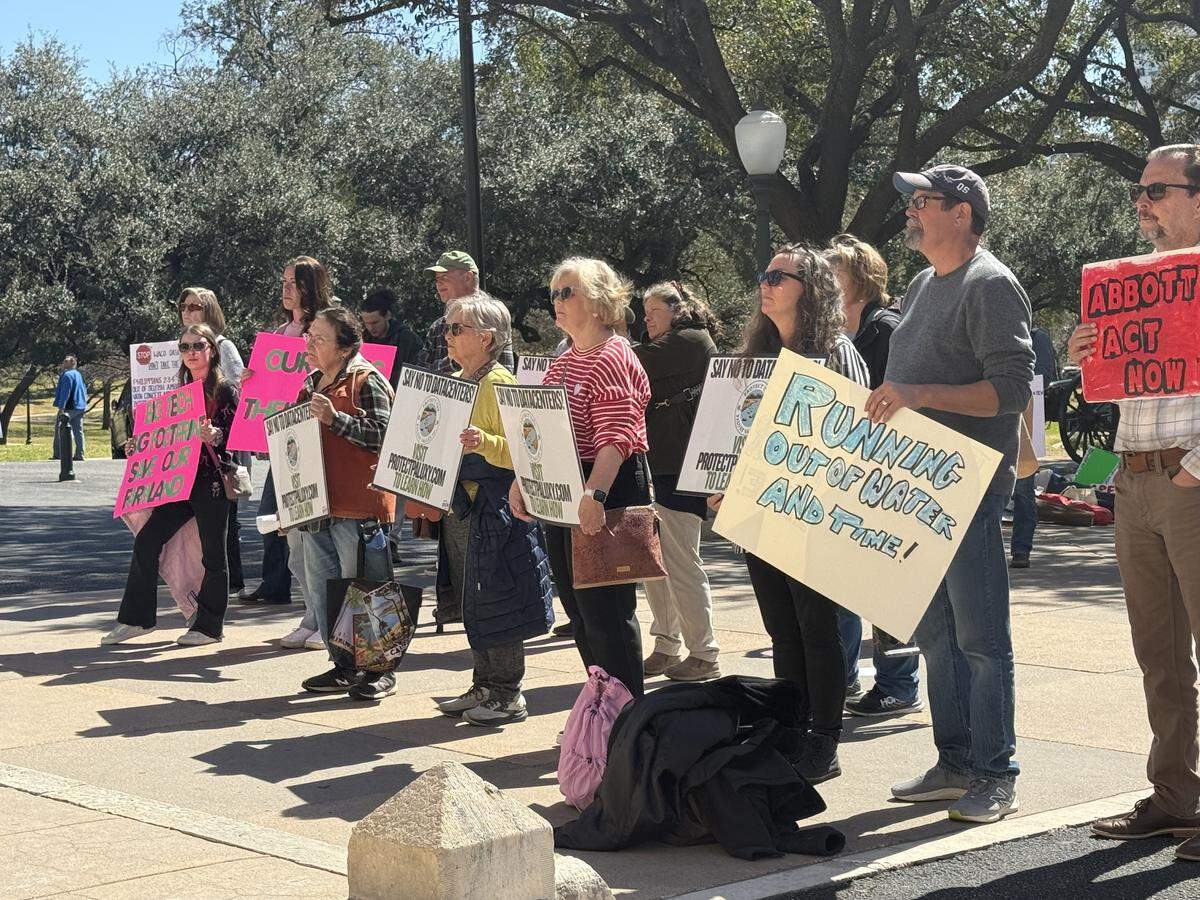 People gathered outside of the Texas Capitol on Feb. 23, calling for a special session on data center expansion in Texas.