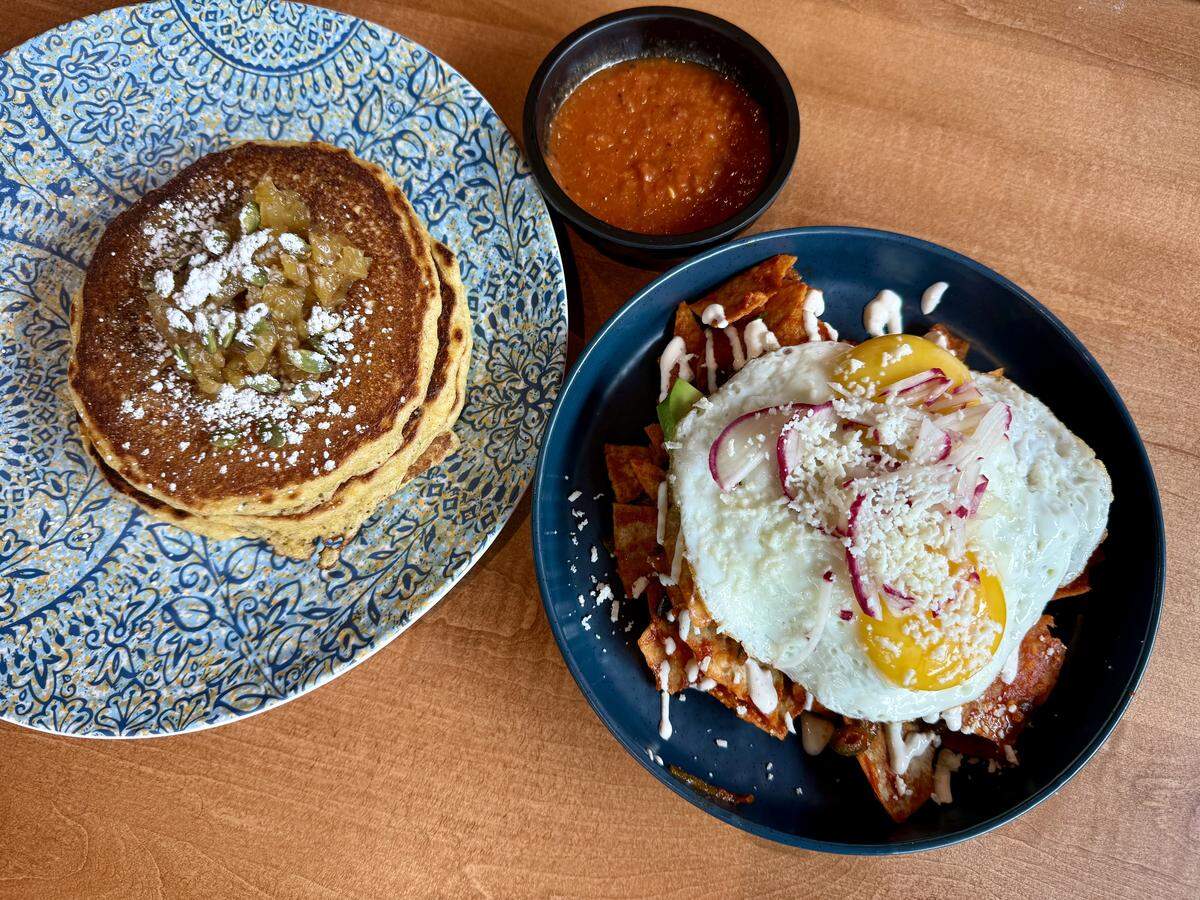 Chilaquiles, right, and pineapple cornmeal pancakes at Tacos & Avocados in Benbrook.
