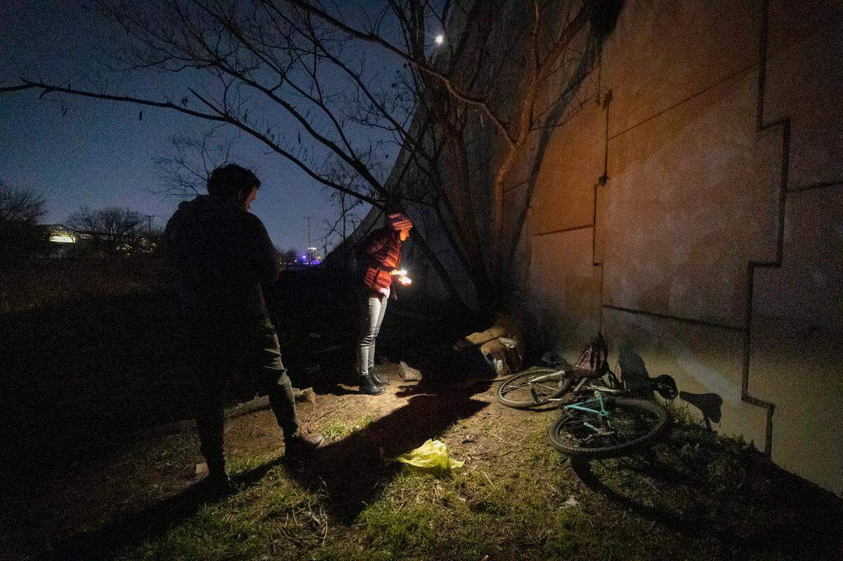 Tarrant County Homeless Coalition planning data analyst Katie Welch speaks with an unsheltered person during an annual count of those experiencing homelessness in January. Welch provided people with information about shelters and housing.