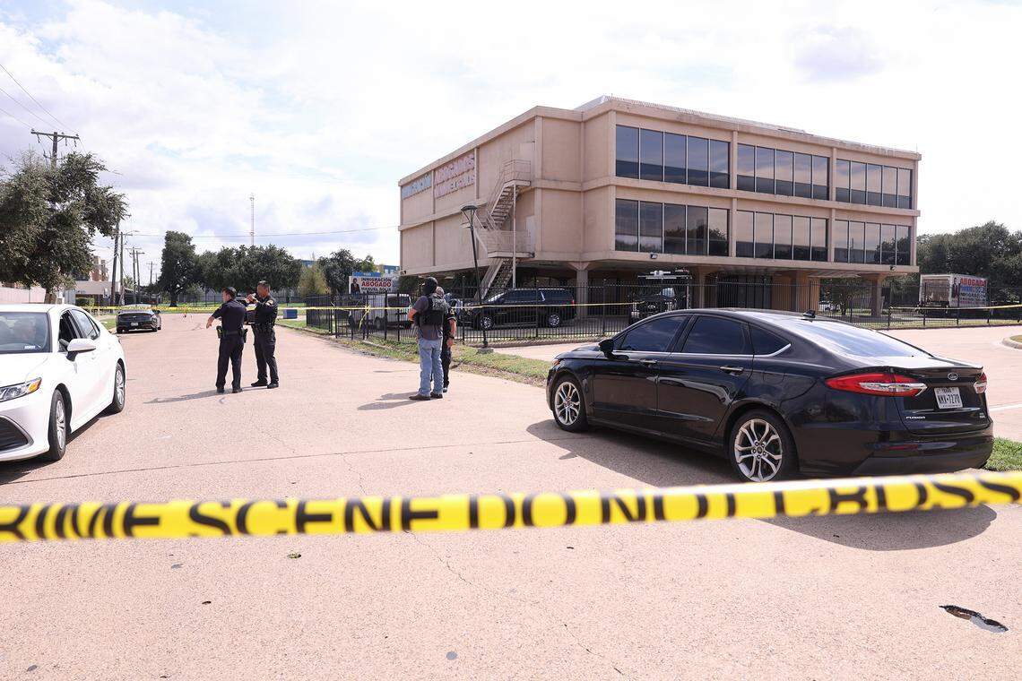 Law enforcement investigate the scene where a shooting at an Immigration and Customs Enforcement facility occurred in Dallas on Wednesday, Sept. 24, 2025.