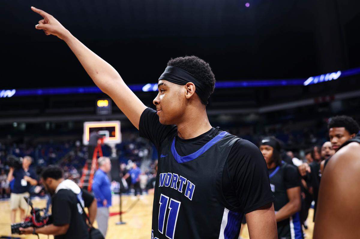North Crowley forward Trey Hall points toward the fans in celebration after winning the Class 6A Division I state championship game against San Antonio Brennan on Saturday at the Alamodome in San Antonio.