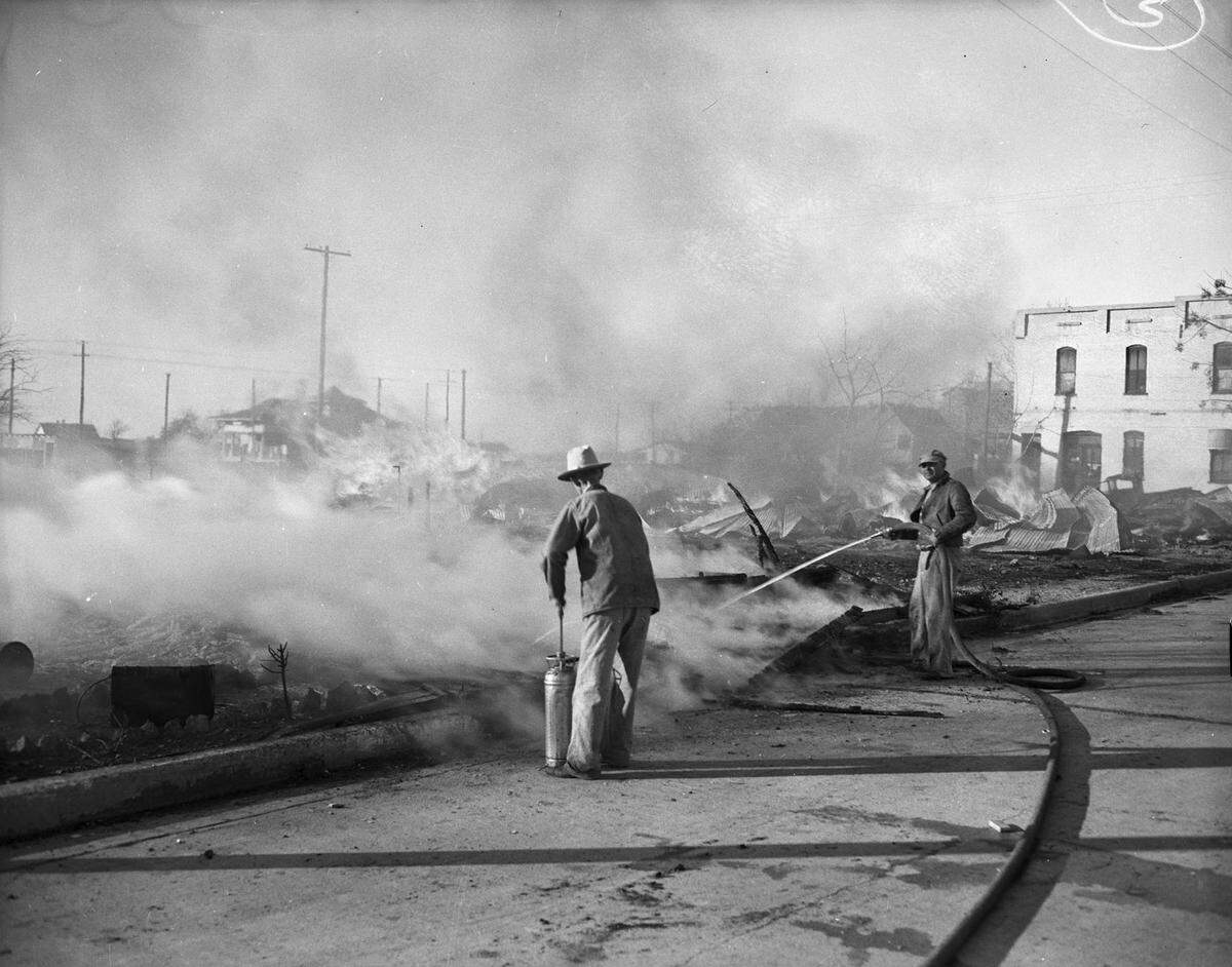 Dec. 5, 1941: Residents of Keller turned firefighters Friday afternoon when a grass fire started a blaze that destroyed a lumber yard, beauty shop, and hardware store. Two volunteers are fighting the flames with the hose that arrived from Roanoke, Texas and a hand extinguisher.