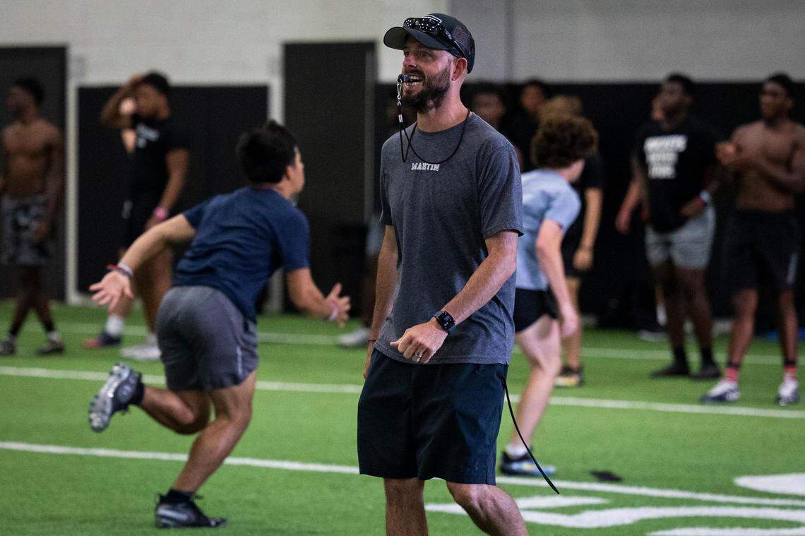Brady Cagle runs drills during summer camp at Arlington Martin.
