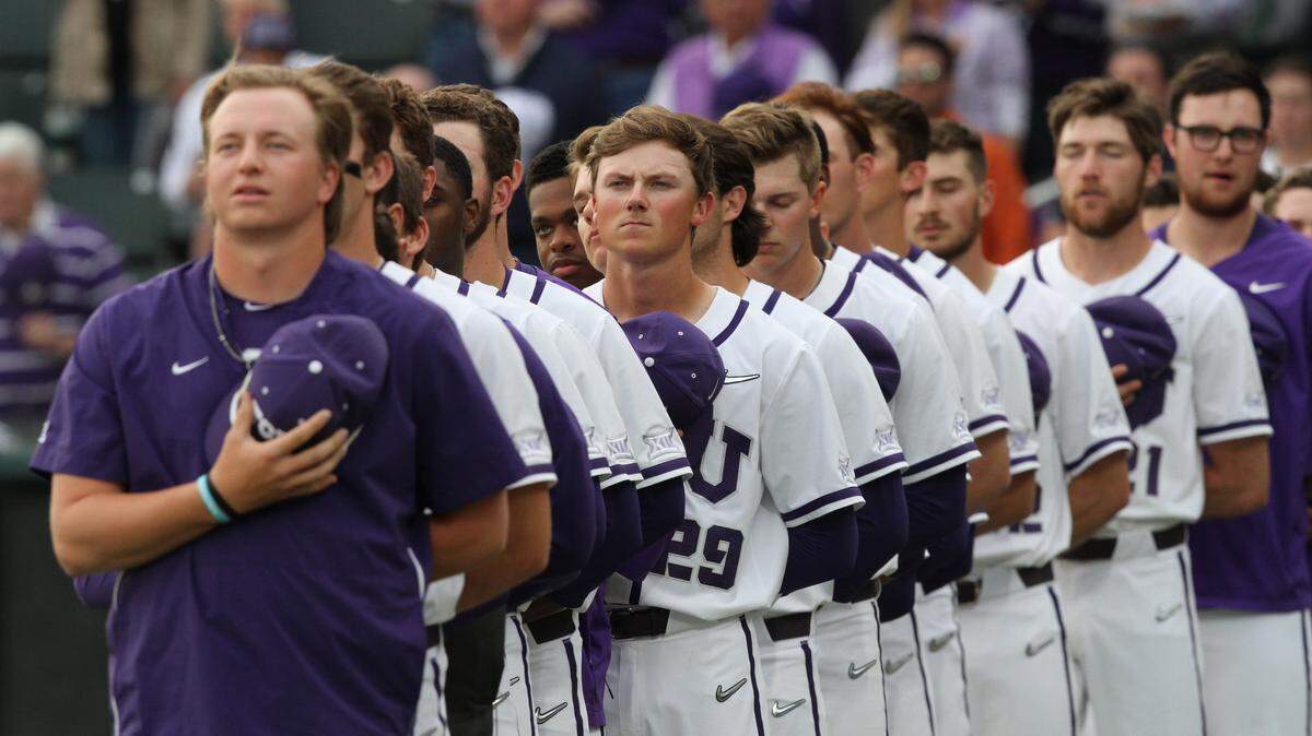 The TCU baseball team lines up for the anthem before the game. The Texas Longhorns played the TCU Horned Frogs in Big 12 baseball Friday, Mar. 22, at Lupton Stadium in Fort Worth.