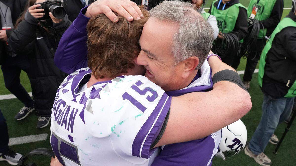 TCU head coach Sonny Dykes hugs quarterback Max Duggan (15) after the Horned Frogs beat Baylor on Saturday.