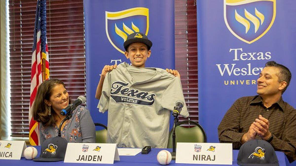 Seventh grader Jaiden Mehta signs with Texas Wesleyan baseball, in partnership with Team IMPACT, along with parents Monica and Niraj, Monday March 25, 2019.