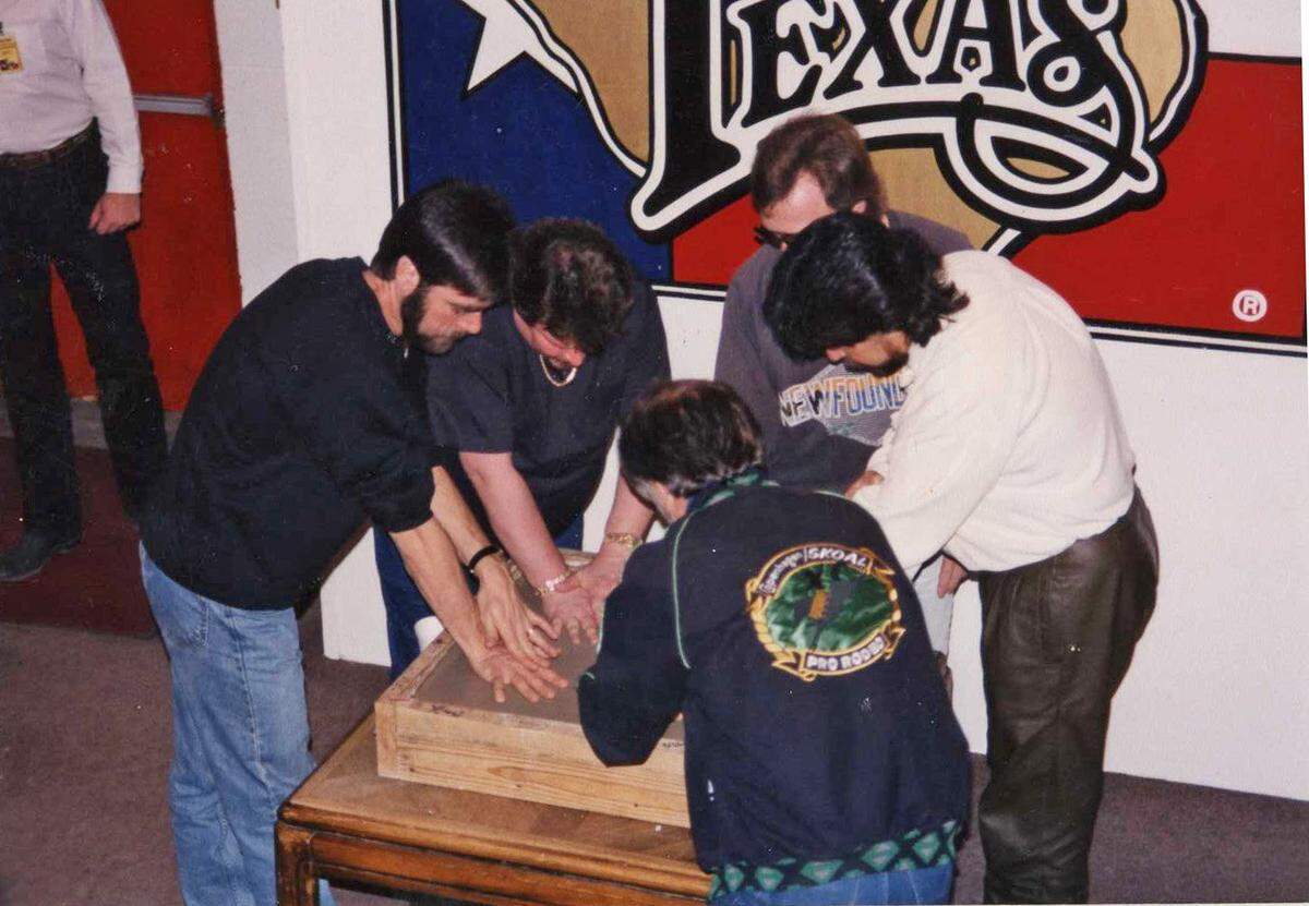 May 1992: Musicians from the band Alabama put their hands in wet concrete at Billy Bob’s Texas.