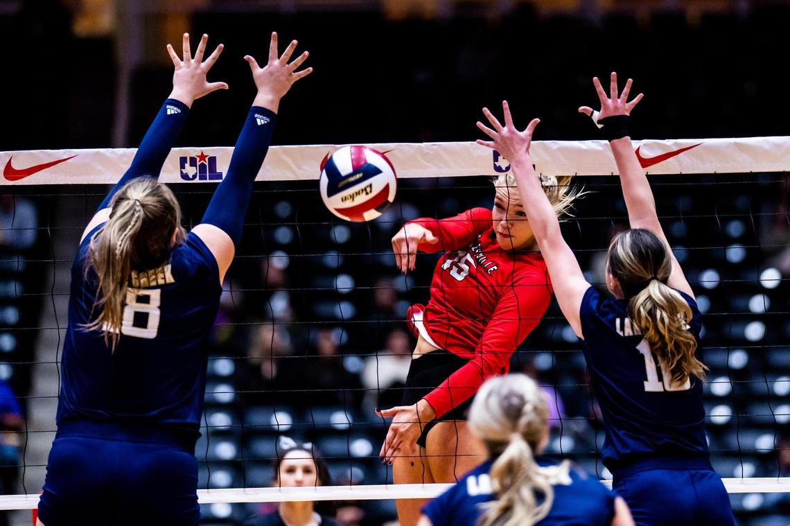 Reagan Engler hits between the block during the 5A state semifinal between Colleyville Heritage and Montgomery Lake Creek at the Curtis Culwell Center in Garland on November 18th, 2022.