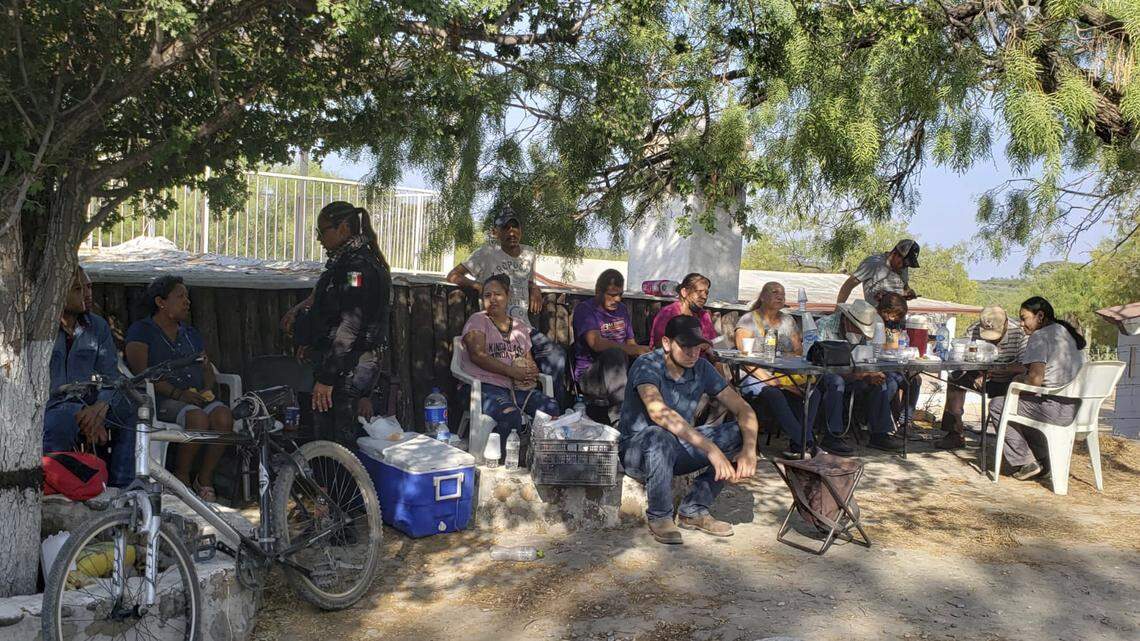 Relatives of miners who are trapped in a collapsed and flooded coal mine wait for information outside the mine in Sabinas in Mexico’s Coahuila state, Thursday, Aug. 4, 2022. The collapse occurred on 10 miners after they breached a neighboring area filled with water on Wednesday, officials said. (AP Photo/Elizabeth Monroy)