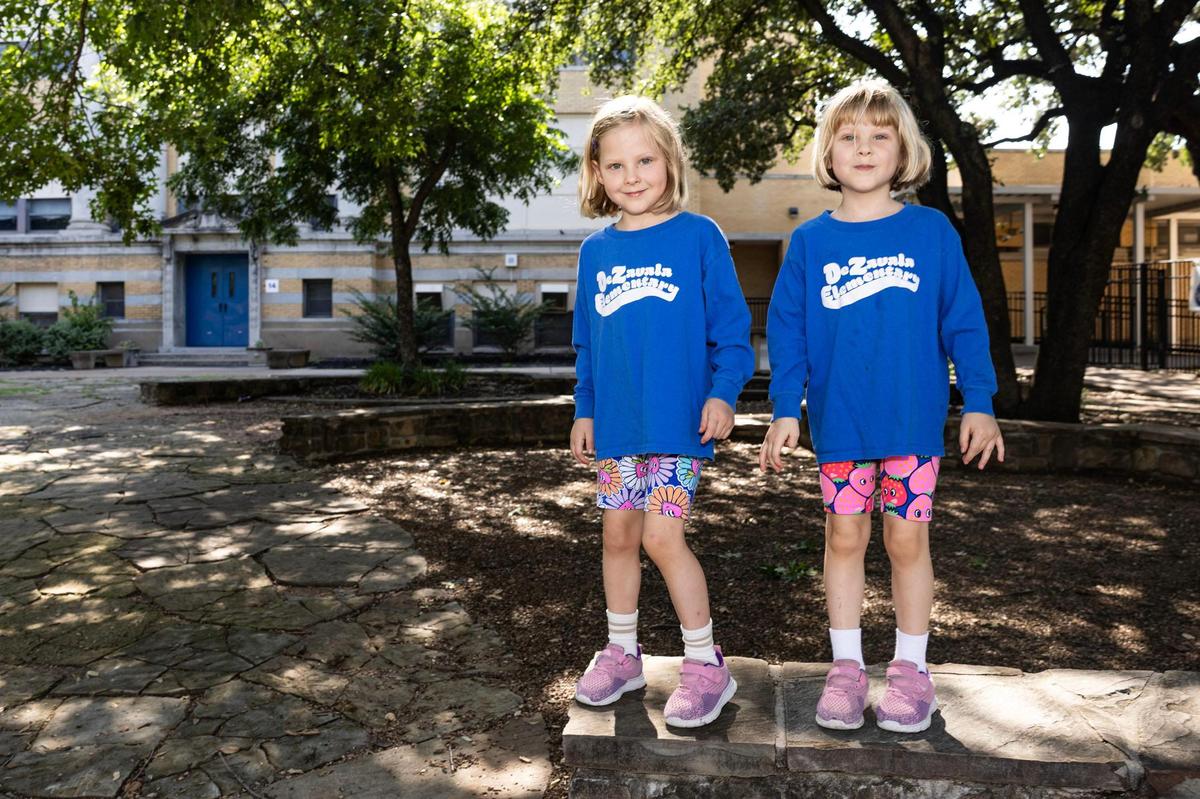 De Zavala students and sisters Olivia, left, and Sophia, 5, right, are photographed in front of De Zavala Elementary School in Fort Worth on June 13.