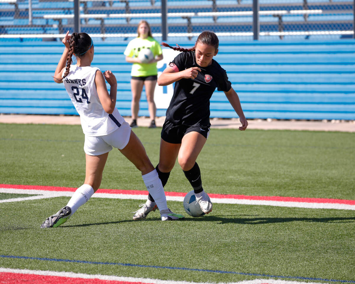 Colleyville Heritage’s Olivia Belcher dribbles in a Class 5A state semifinal win over Pflugerville Hendrickson in Georgetown, Texas on April 11, 2024.