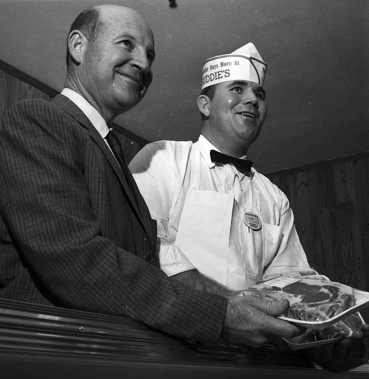 Nov. 12, 1958: Buddies President J.C. Pace Jr., left, assists Babe Herman, meat manager, in preparing a fresh meat display at Buddies new store at the Southeast intersection of Jacksboro Highway and N.W. 28th Street.