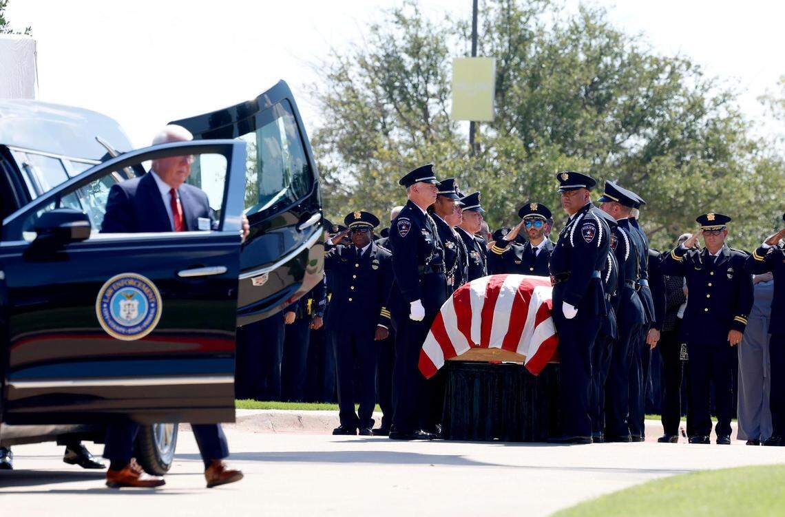 Members of the Arlington Police Department’s Honor Guard prepare to place the coffin of fellow officer Darrin McMichael into the hearse on Wednesday, September 27, 2023, at Crossroads Christian Church in Grand Prairie. McMichael, a member of Arlington’s Motorcycle Unit, was killed on Sept. 21.