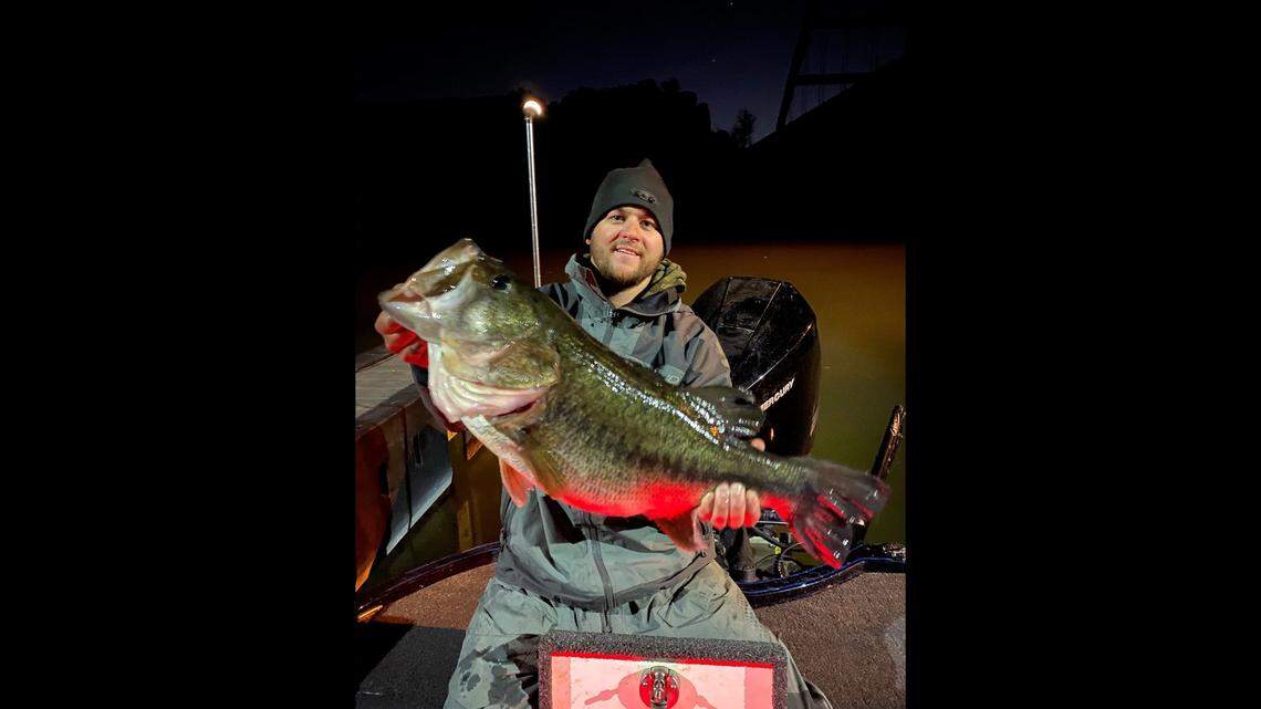 CJ Oates shows off his 13-pound largemouth bass.