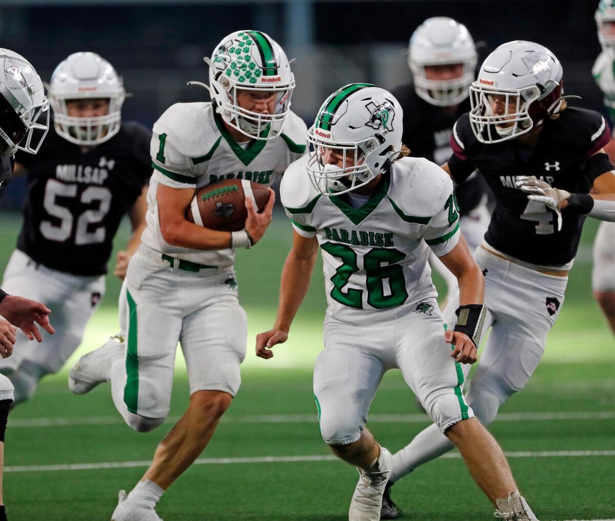Paradise’s Ayden Winters (1) breaks up the middle following the blocking of Slade Shannon (26) and is brought down on the one yard line in the second half of a high school football game at AT&T Stadium in Arlington, Texas, Thursday, Sept. 15, 2022. Paradise defeated Millsap 56-14.