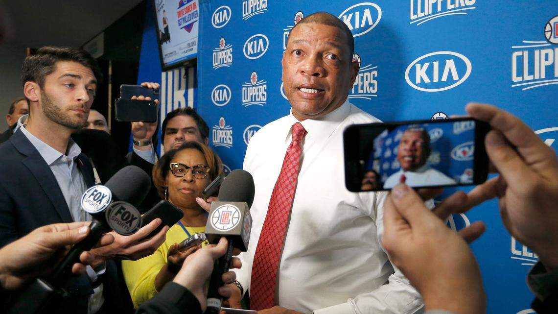 FILE- In this Jan. 26, 2020 file photo, Los Angeles Clippers head coach Doc Rivers talks with the media after an NBA basketball game against the Orlando Magic in Orlando, Fla. (AP Photo/Reinhold Matay, File))