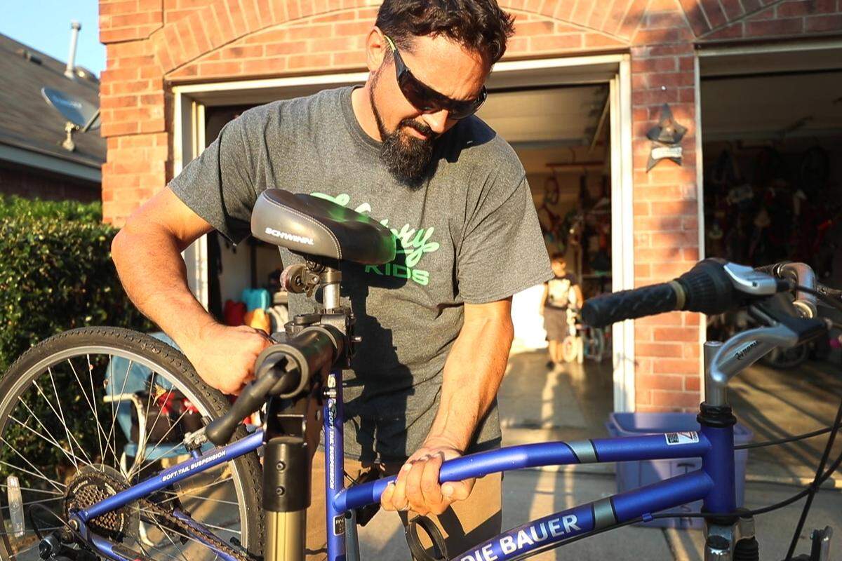 Daniel Guido repairs a bike for free Thursday, Sept. 5, 2019, at home in Fort Worth. Guido is asking the city to give him more bikes to giveaway.