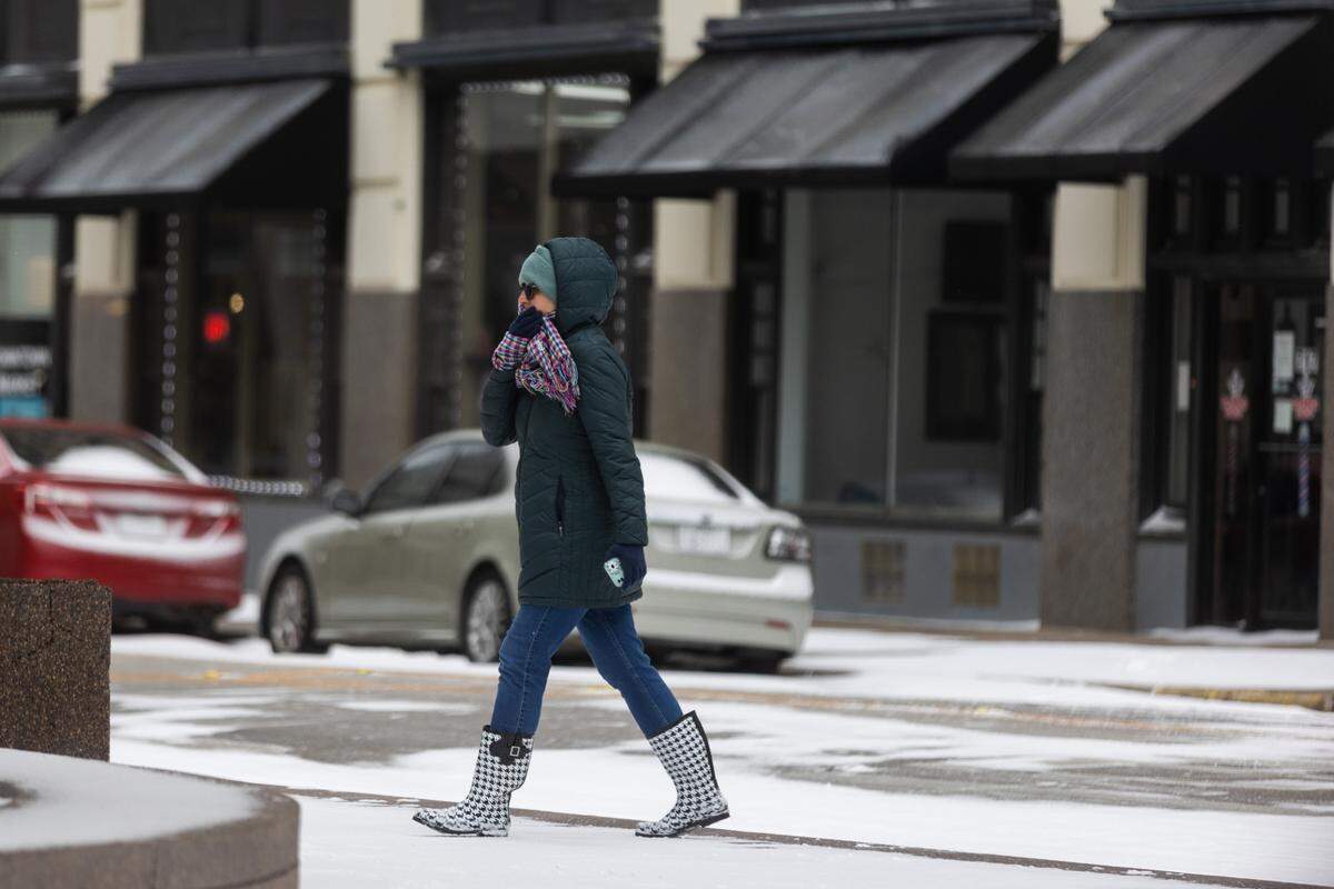 A woman walks in downtown Fort Worth during a winter storm Thursday, Feb. 3, 2022.