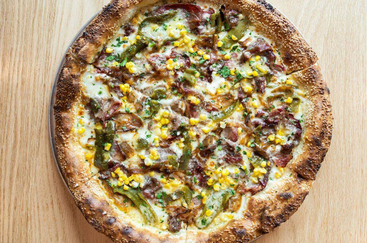 Zoli’s Pizza serves a brisket-Hatch green chiles pizza.