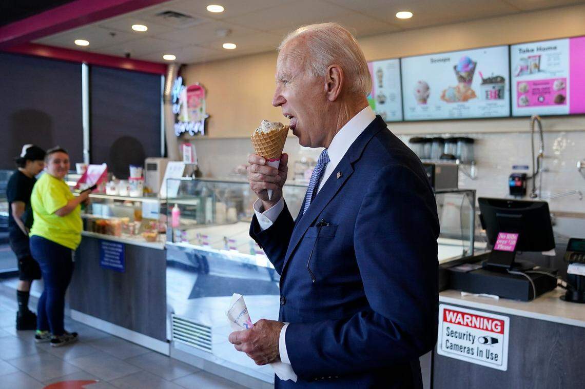 President Joe Biden eats an ice cream cone at a Baskin-Robbins in Portland, Ore., Saturday, Oct. 15, 2022. (AP Photo/Carolyn Kaster)