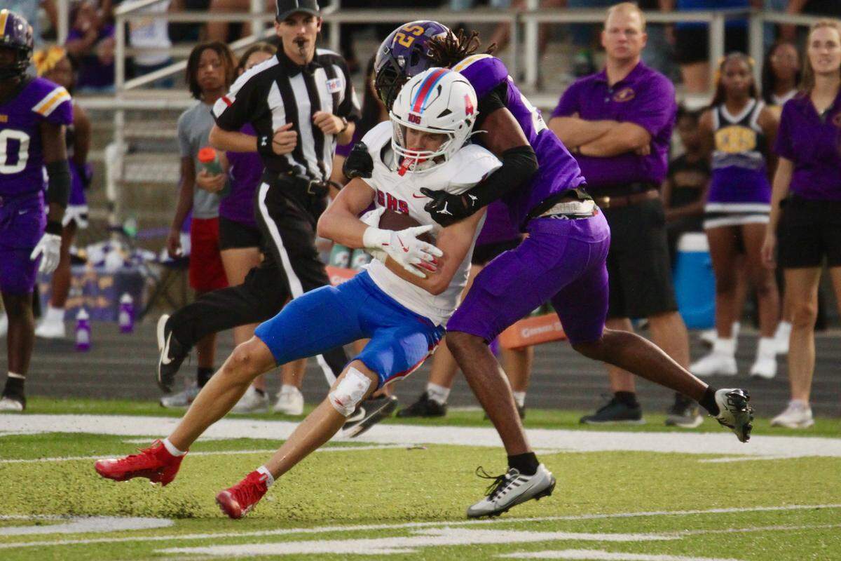 Everman’s Marquis Davis (25) tackles Grapevine’s Rylan Goin (4) in a District 3-5A D2 game on Friday, September 12, 2025 at Marr Stadium in Everman, Texas.