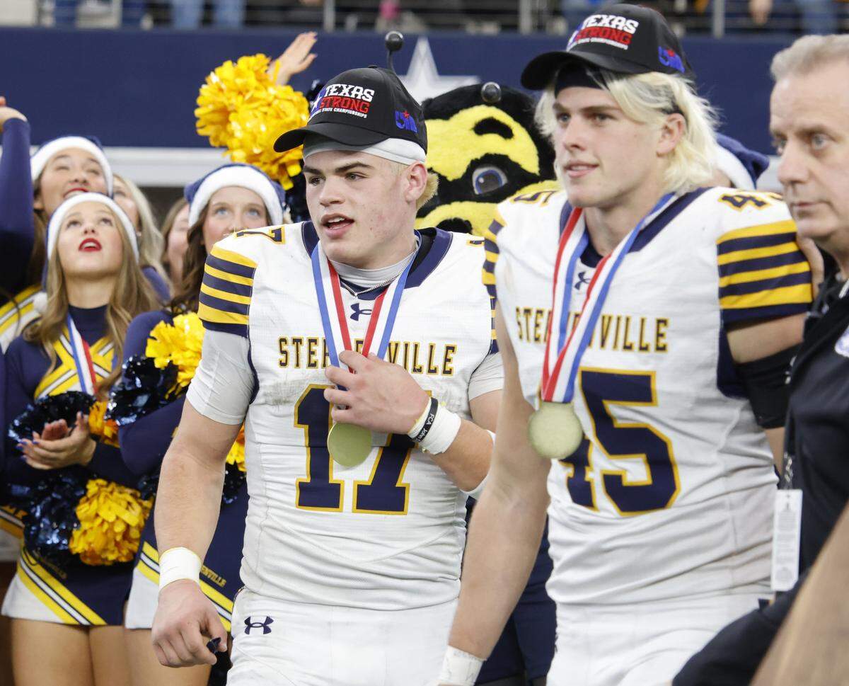MVP's Stephenville quarter back Trot Jordan (17) and Stephenville linebacker Hudson Butchee (45) wait to receive their MVP honors after defeating Kilgore in the UIL Class 4A Division I championship game on Friday Dec. 19, 2025 at AT&T Stadium in Arlington, Texas.