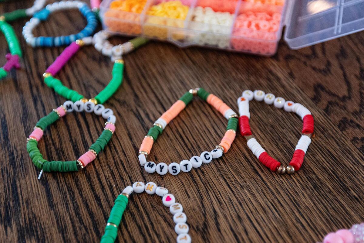 Max, 11, and Coco Grieshaber, 8, create custom-made bracelets in their family home in Fort Worth on Tuesday, July 15.