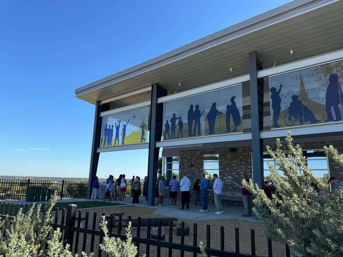 Voters line up at the Como Community Center on Monday, Oct. 21, 2024, on the first day of early voting for the Nov. 5 general election. 