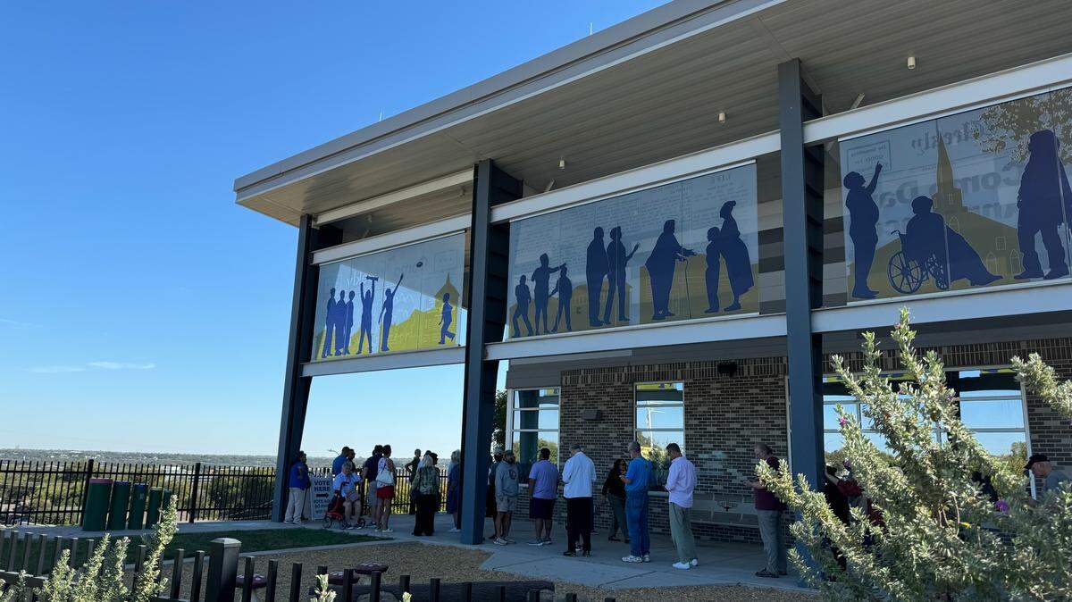 Voters line up at the Como Community Center on Monday, Oct. 21, 2024, on the first day of early voting for the Nov. 5 general election.