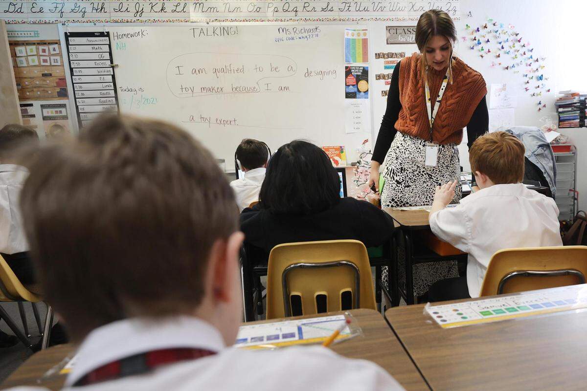 Teacher Melissa Richards walks through a class to help students with learning differences on Dec. 13, 2021, at Hill School of Fort Worth. With a small student-to-teacher ratio, staff at the private school say they have the time and resources to work one-on-one with parents to figure out how each child learns best.