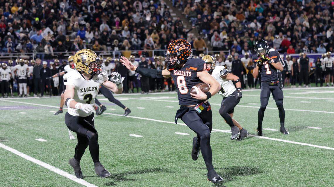 Aledo quarterback Hauss Hejny attempts a stiff arm in a regional final win over Abilene.