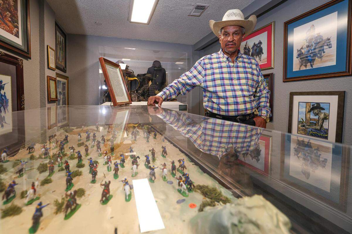 Jim Austin, a co-founder of the National Multicultural Western Heritage Museum in Fort Worth, showcases his exhibit on the Buffalo Soldiers, a group of Black soldiers who helped protect the nation’s westward expansion.