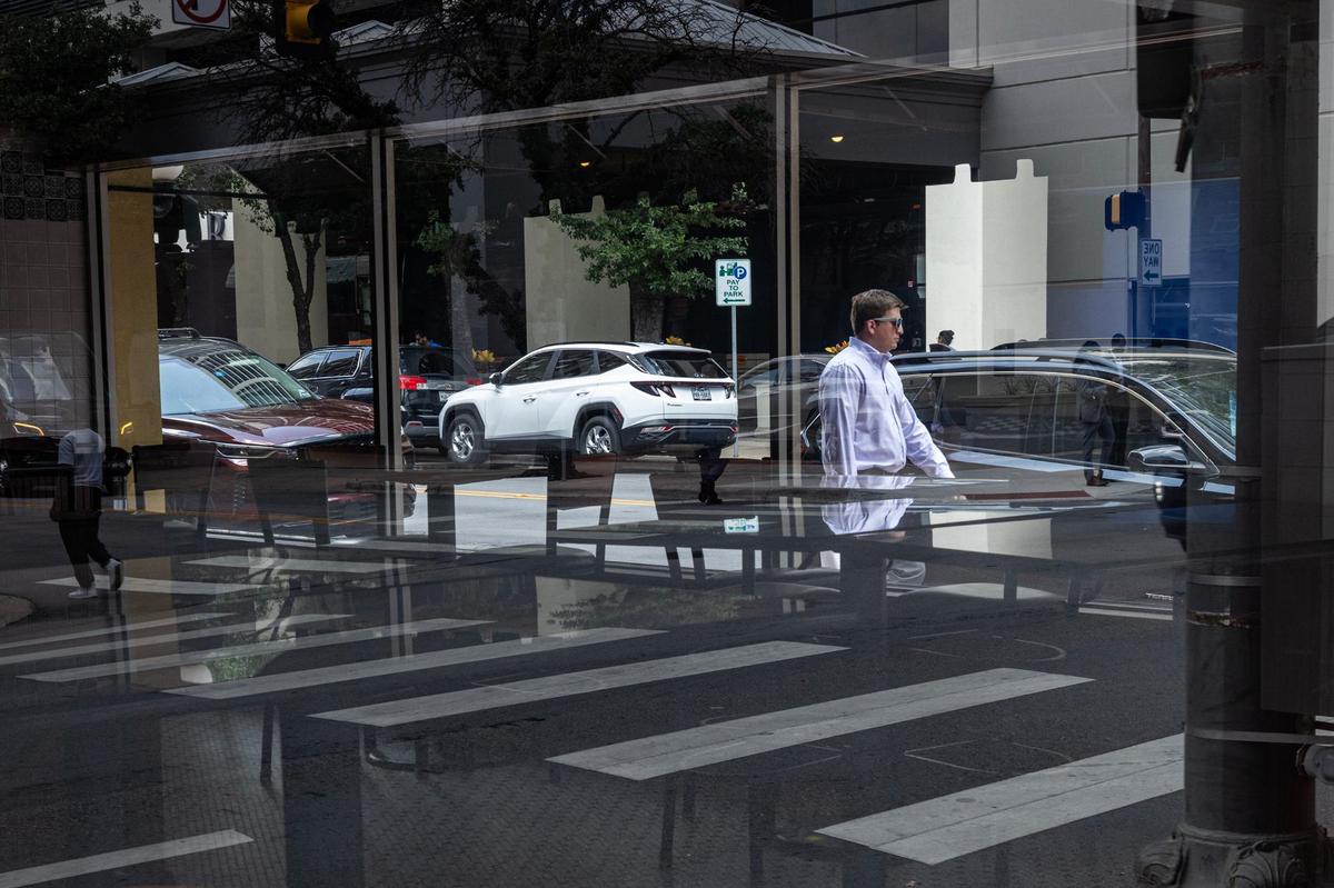 A man walks by the empty and closed former Pizzeria Uno Restaurant & Bar on Houston Street in downtown Fort Worth on Wednesday, July 24, 2024.