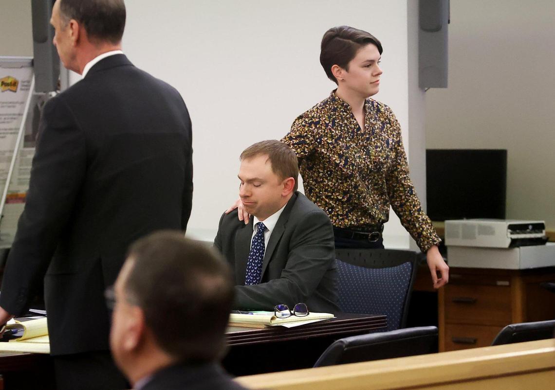 Alyssa Dean, Aaron Dean’s sister, touches his shoulder while returning to her seat after giving testimony during the sentencing phase of her brother’s triall at Tarrant County’s 396th District Court on Friday, December 16, 2022, in Fort Worth. Dean was found guilty of manslaughter in the shooting death of Atatiana Jefferson in 2019.