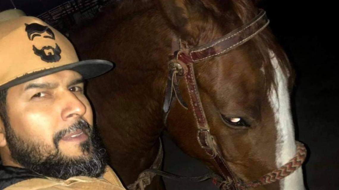 Arnulfo Omar Martinez poses for a photo with his horse, Hammer. The 43-year-old was shot and killed on Aug. 6 at the stables where he kept the horse, with his 13-year-old son nearby, according to his wife and sister-in-law.