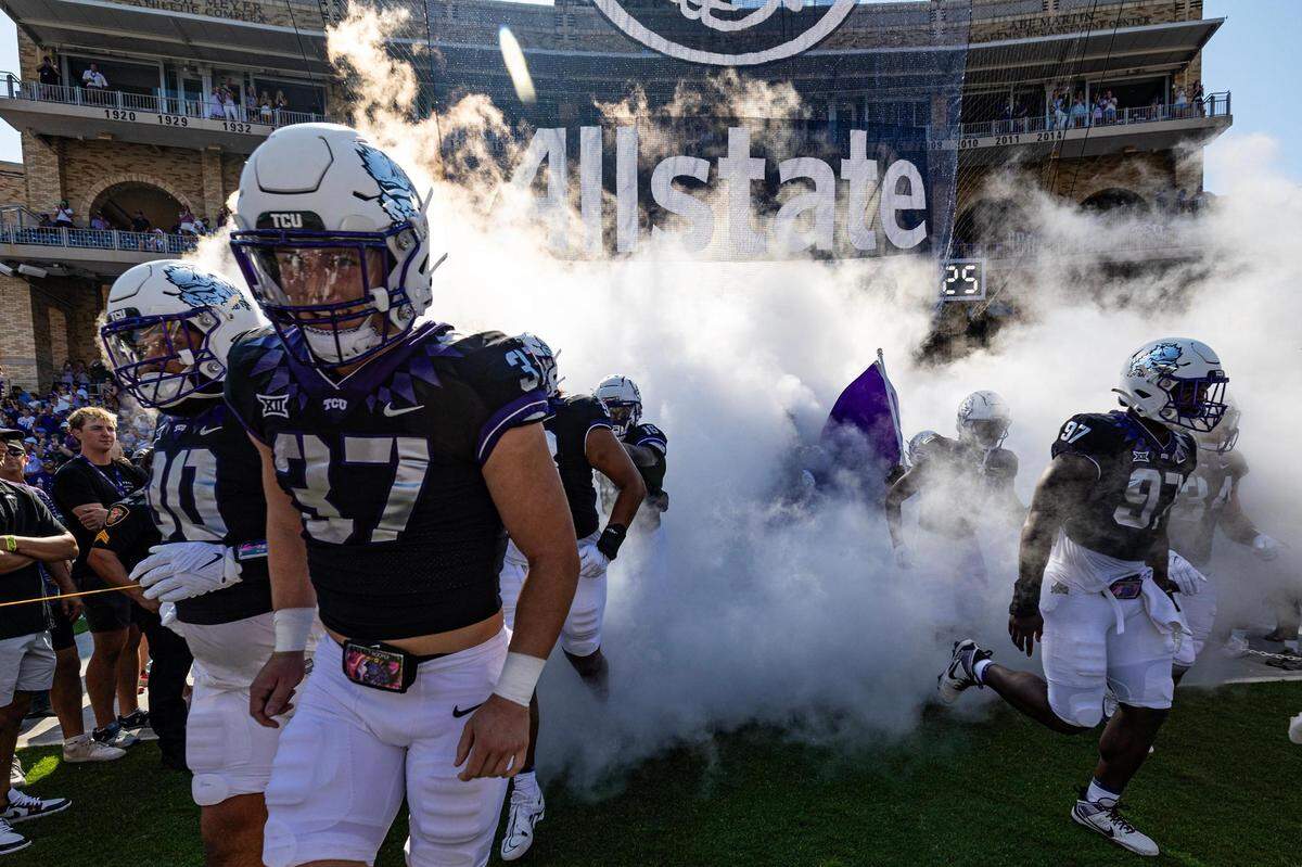 The TCU football team emerges out of the tunnel prior to a college football game between the TCU Horned Frogs and the SMU Mustangs at Amon G. Carter Stadium in Fort Worth on Saturday, Sept. 23, 2023.