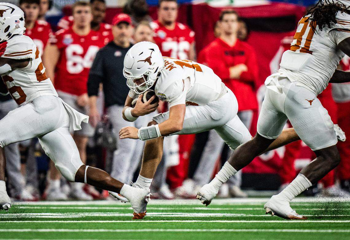 Jan 10, 2025; Arlington, TX, USA; Texas Longhorns quarterback Arch Manning (16) carries the ball for a first down in the second quarter as the Texas Longhorns play the Ohio State Buckeyes in the Cotton Bowl College Football Playoff semi-final at AT&T Stadium in Dallas, Texas. Mandatory Credit: Sara Diggins/USA TODAY Network via Imagn Images