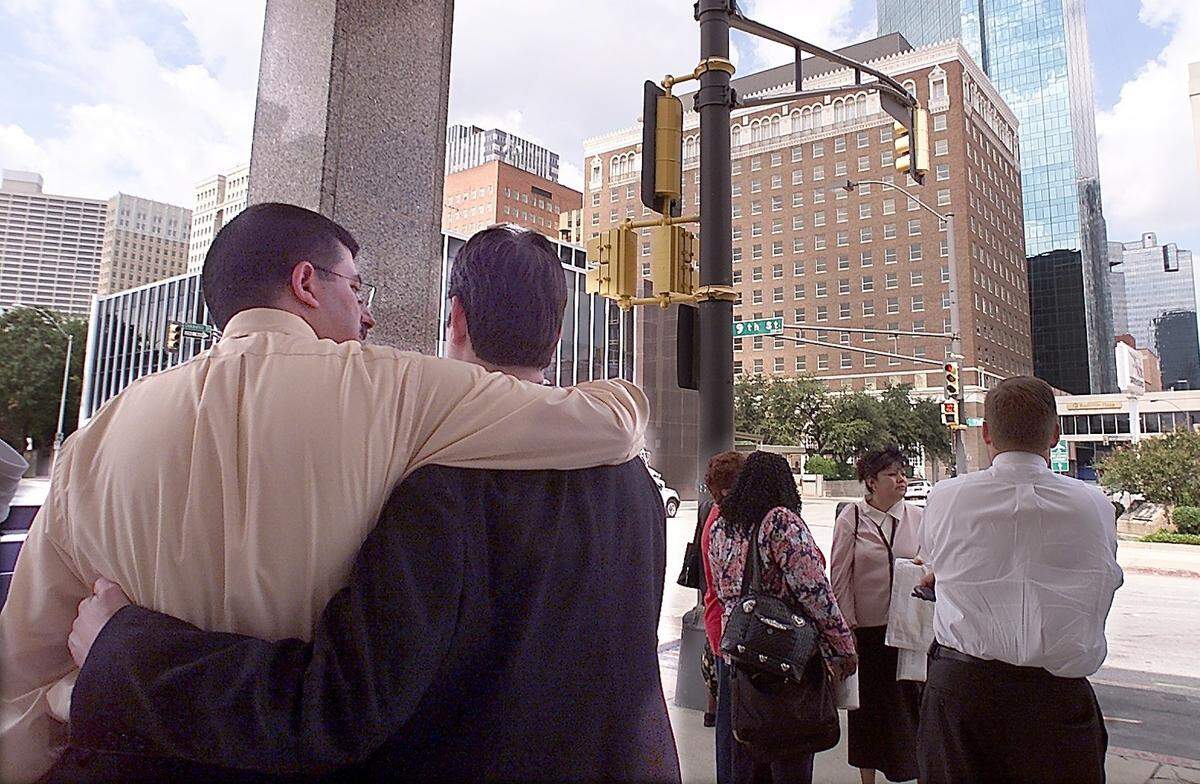 Guests and employees from the Radisson Hotel console each other and discuss the day’s events on Sept. 11, 2001 after the hotel was evacuated due to bomb threats which may have been connected to the terrorism at the World Trade Center and the Pentagon.