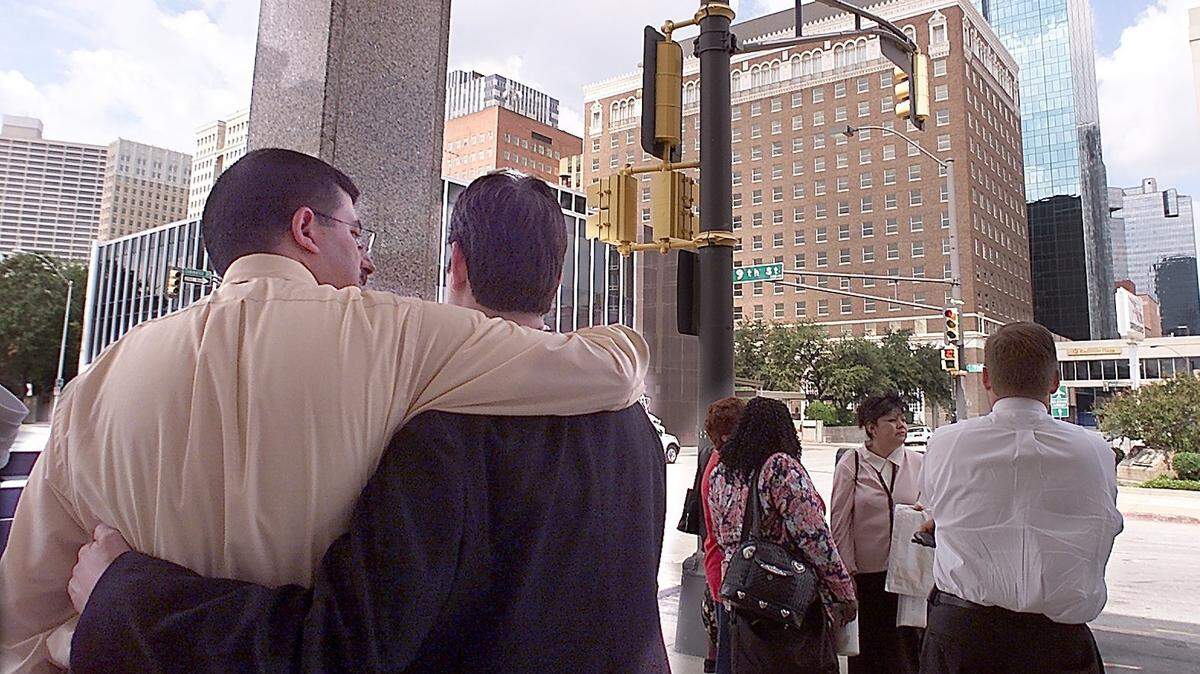 Guests and employees from the Radisson Hotel console each other and discuss the day’s events on Sept. 11, 2001, after the hotel was evacuated due to bomb threats which may have been connected to the terrorism at the World Trade Center and the Pentagon.