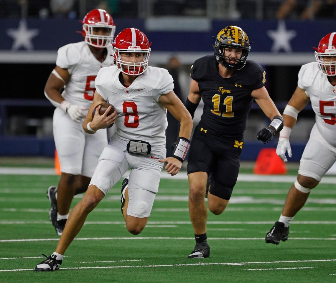 Columbus quarterback Adam Schobel (8) runs on a quarterback keeper during the UIL 3A D1 State Championship football game at AT&T Stadium in Arlington, Texas, Thursday, Dec. 19, 2024.
