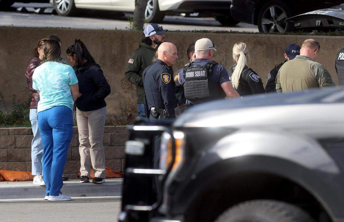 Members of the Fort Worth Police Department and other emergency personnel respond to a report of a potential threat at the University of North Texas Health Science Center in Fort Worth on Wednesday, November 16, 2022. University officials encouraged everyone in the area to seek shelter immediately in a secure location.