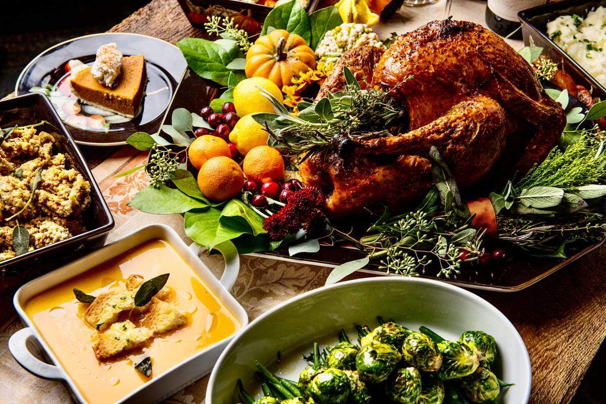 CRÚ Food & Wine Bar’s publicity photo for Thanksgiving includes turkey, butternut squash bisque and pumpkin cheesecake.