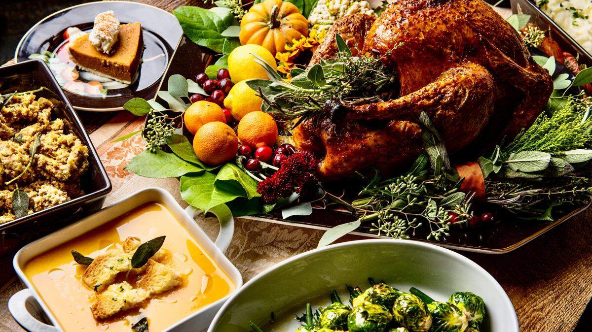 CRÚ Food & Wine Bar’s publicity photo for Thanksgiving includes turkey, butternut squash bisque and pumpkin cheesecake.