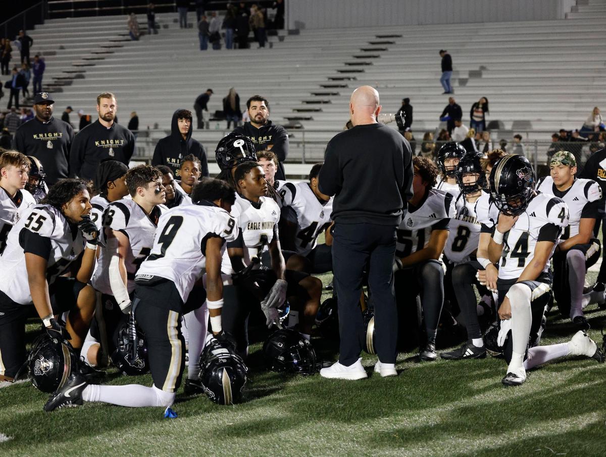 Eagle Mountain head coach Jeremy Mullins talks to his team after an UIL 4A D2 Region 1 Bi-district football playoff game at Kangaroo Stadium in Weatherford, Texas, Friday, Nov. 15, 2024.