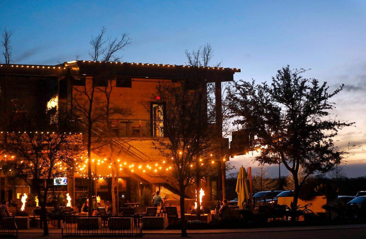 The patio at Press Cafe, located at The Trailhead at Clearfork, is large and features fire pits and lighting for a pleasant evening.