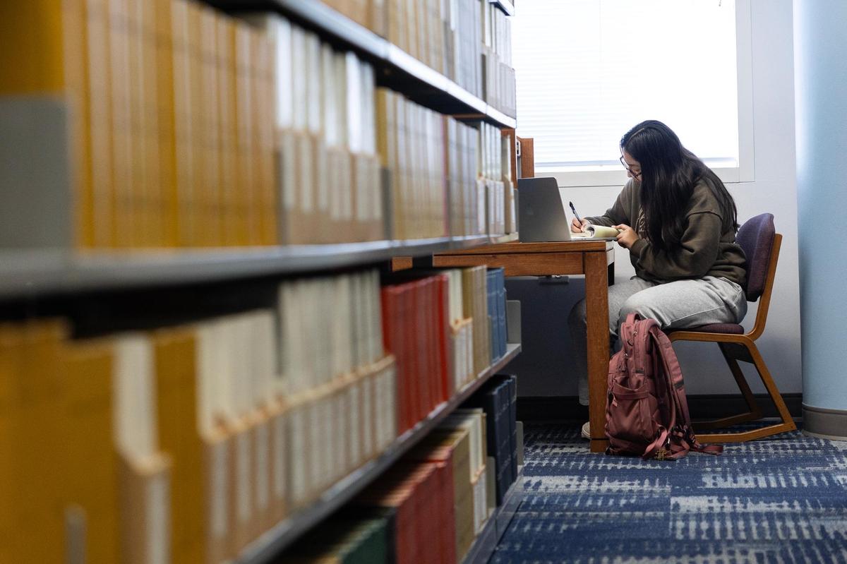 Junior Vianey Herrera studies on the second floor of the Eunice and James L. West Library at Texas Wesleyan University.