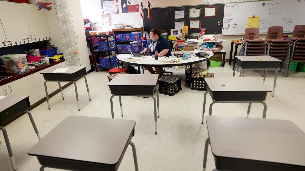 Third grade teacher Lacy Pruitt catches up on work on Friday, April 14, 2023, at Houston Elementary in Mineral Wells. Mineral Wells ISD is one of the dozens of districts that shifted to a four-day school week.