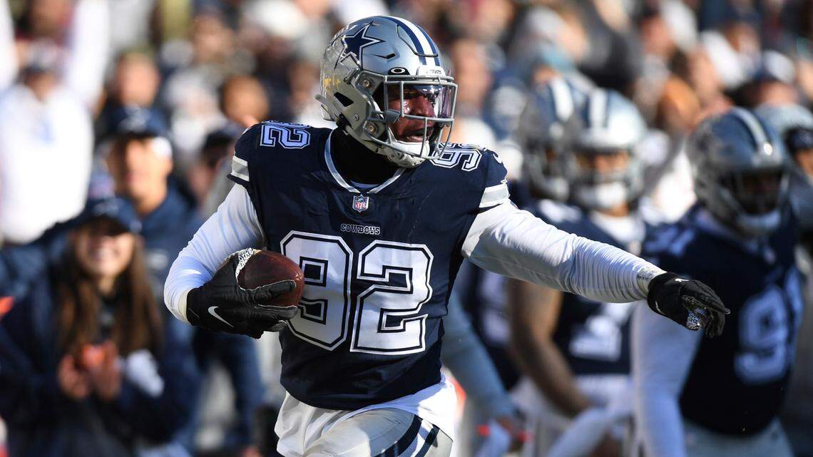 Dallas Cowboys defensive end Dorance Armstrong (92) returns a fumble for a touchdown during the first quarter of an NFL football game against the Washington Football Team, Sunday, Dec. 12, 2021, in Landover, Md. (AP Photo/Terrance Williams)