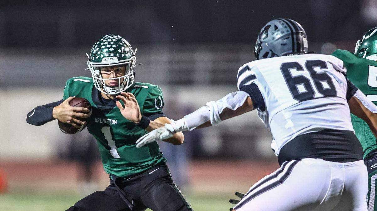 Arlington quarterback Coleman Cravens get pressured by Martin’s Brandon Munoz in a game Thursday, Nov. 7, 2024, game at UTA’s Maverick Stadium in Arlington.